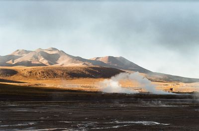 Scenic view of volcanic landscape against sky