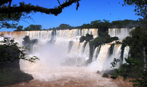 Panoramic view of waterfall against sky