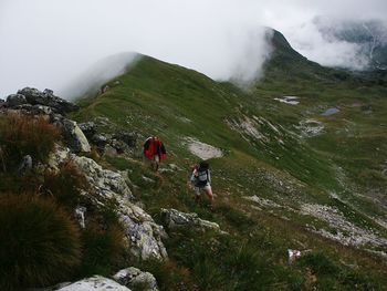 People hiking on mountain