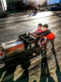 Boy sitting in shopping cart