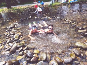 People swimming in water
