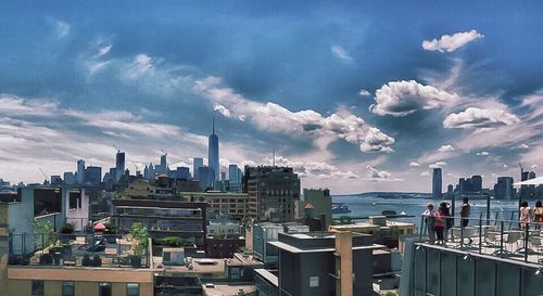 Panoramic view of cityscape against dramatic sky