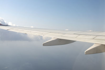 Aircraft wing in sky