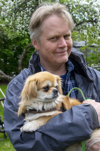 Portrait of man with dog