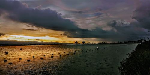 Scenic view of sea against dramatic sky