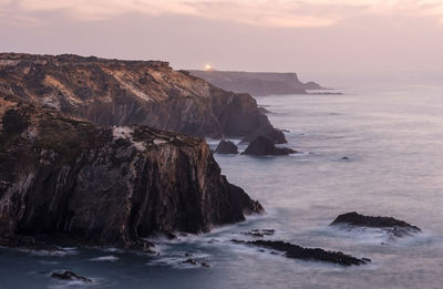 Scenic view of sea against sky during sunset