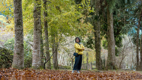 Side view of woman standing on field