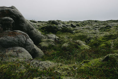 Scenic view of rocks against clear sky