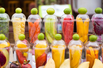 Close-up of fruits in glass for sale