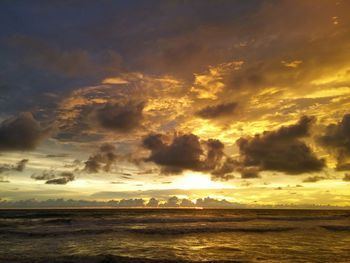 Scenic view of calm sea at sunset