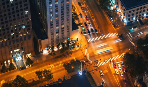 High angle view of cars on city street at night