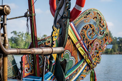 Close-up of multi colored railing against sky