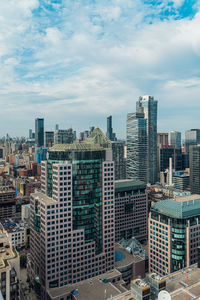 Modern buildings in city against sky