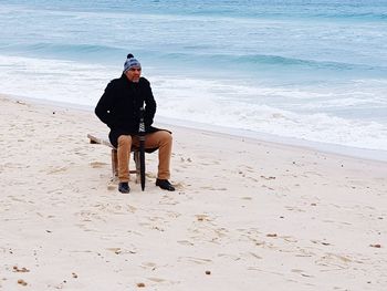 Full length of young man on beach