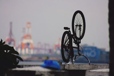 Close-up of bicycle against sky