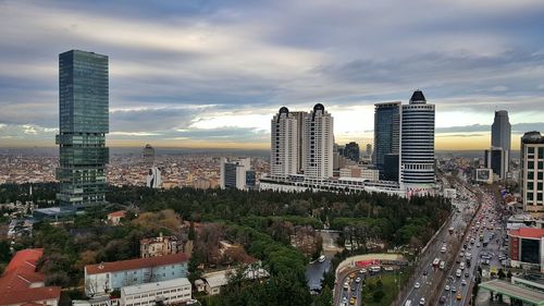 Cityscape against cloudy sky