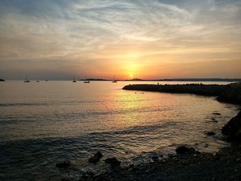 Scenic view of sea against sky during sunset