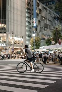 People riding bicycle in city