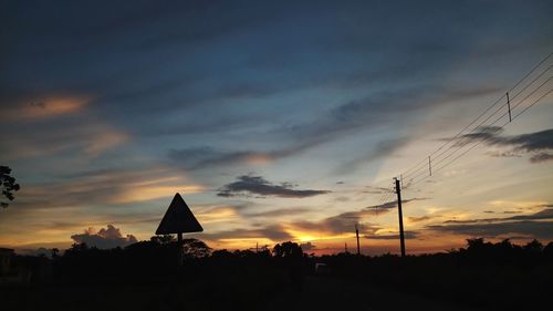 Silhouette trees against sky during sunset