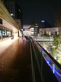 Illuminated city street at night