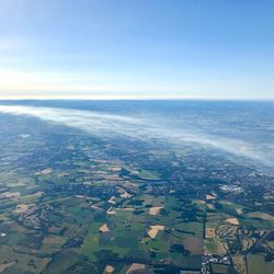Aerial view of agricultural field against sky
