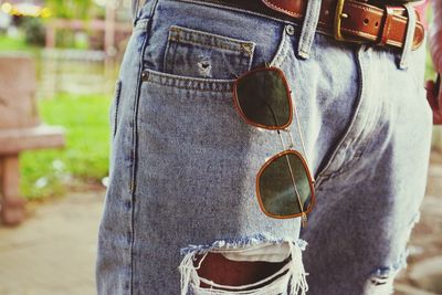 Midsection of man with sunglasses