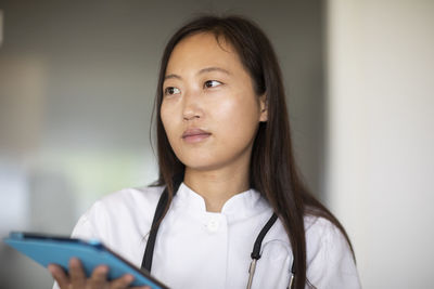 Young asia female doctor woman with report in a practice