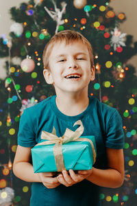 Portrait of cute girl holding gift