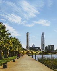 View of skyscrapers against cloudy sky