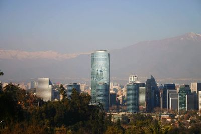 Modern buildings in city against sky