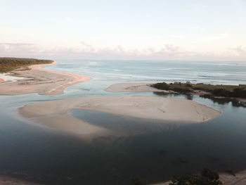 Scenic view of beach against sky