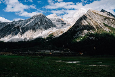 Scenic view of snowcapped mountains against sky