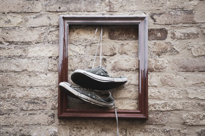 Window on abandoned house wall