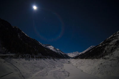 Scenic view of landscape against clear sky at night