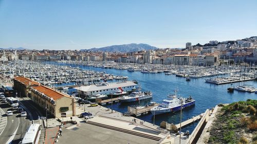 High angle view of boats moored at harbor