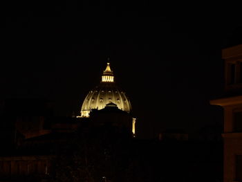 Illuminated cathedral against sky at night