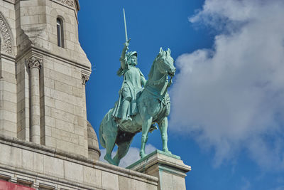 Low angle view of statue against sky