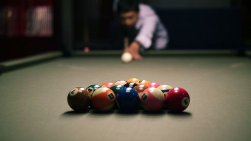 Woman playing with ball on table