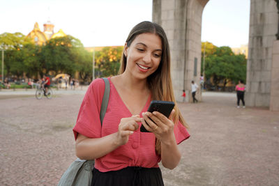 Young woman using mobile phone