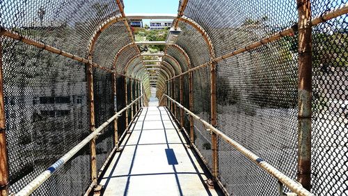 Footbridge against sky