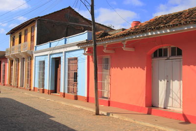 Exterior of building by street against sky