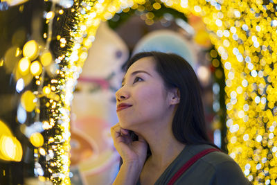 Portrait of young woman looking away