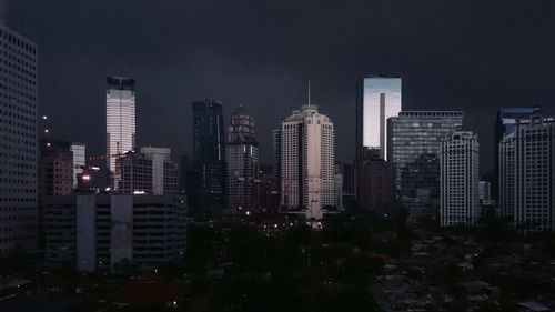 Cityscape against sky at night