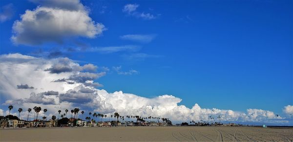 Panoramic view of beach against blue sky