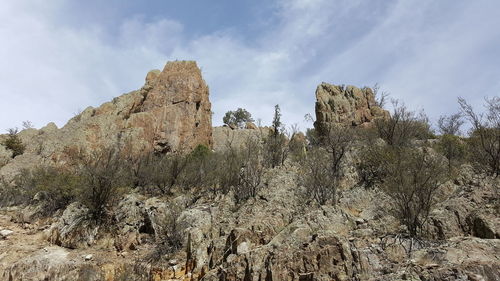 Low angle view of rocks against sky