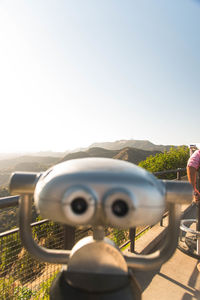 Man looking at camera against sky