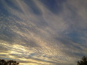Low angle view of dramatic sky during sunset