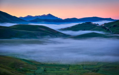 Scenic view of landscape against sky during sunset