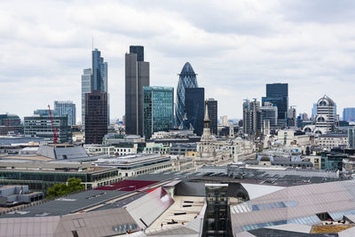 View of london cityscape against cloudy sky