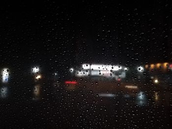 Full frame shot of wet glass window in rainy season